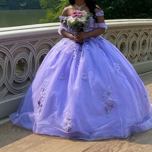 Lilac colored quinceañera dress, used once and includes petticoat.